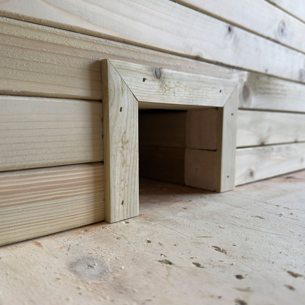 Wooden planter with a built-in hedgehog house